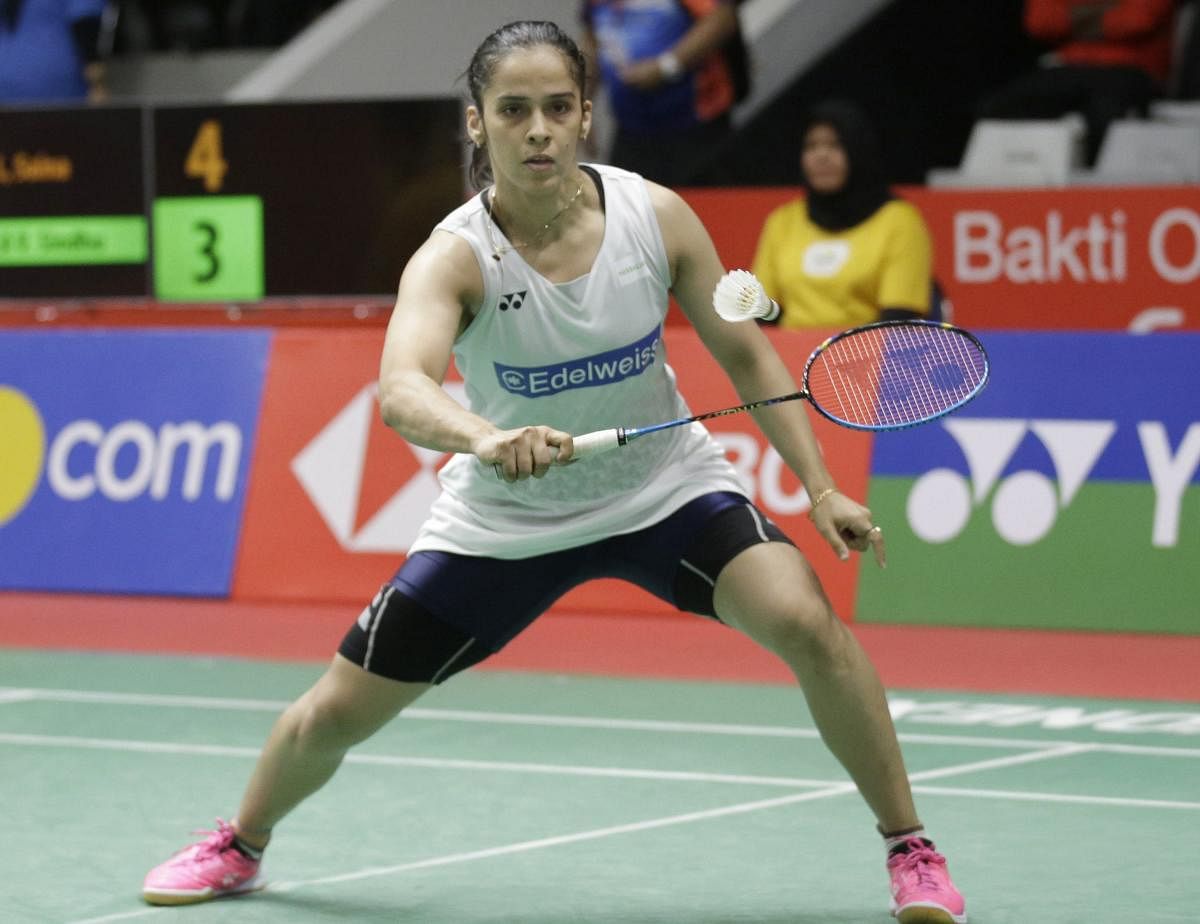 Jakarta : India's Saina Nehwal return a shot to Pusarla V. Sindhu of India's during the quarterfinal round of the women's single match the Indonesia Masters badminton tournament at Istora Stadium in Jakarta, Indonesia, Friday, Jan. 26, 2018. AP/PTI(AP1_26_2018_000282B)