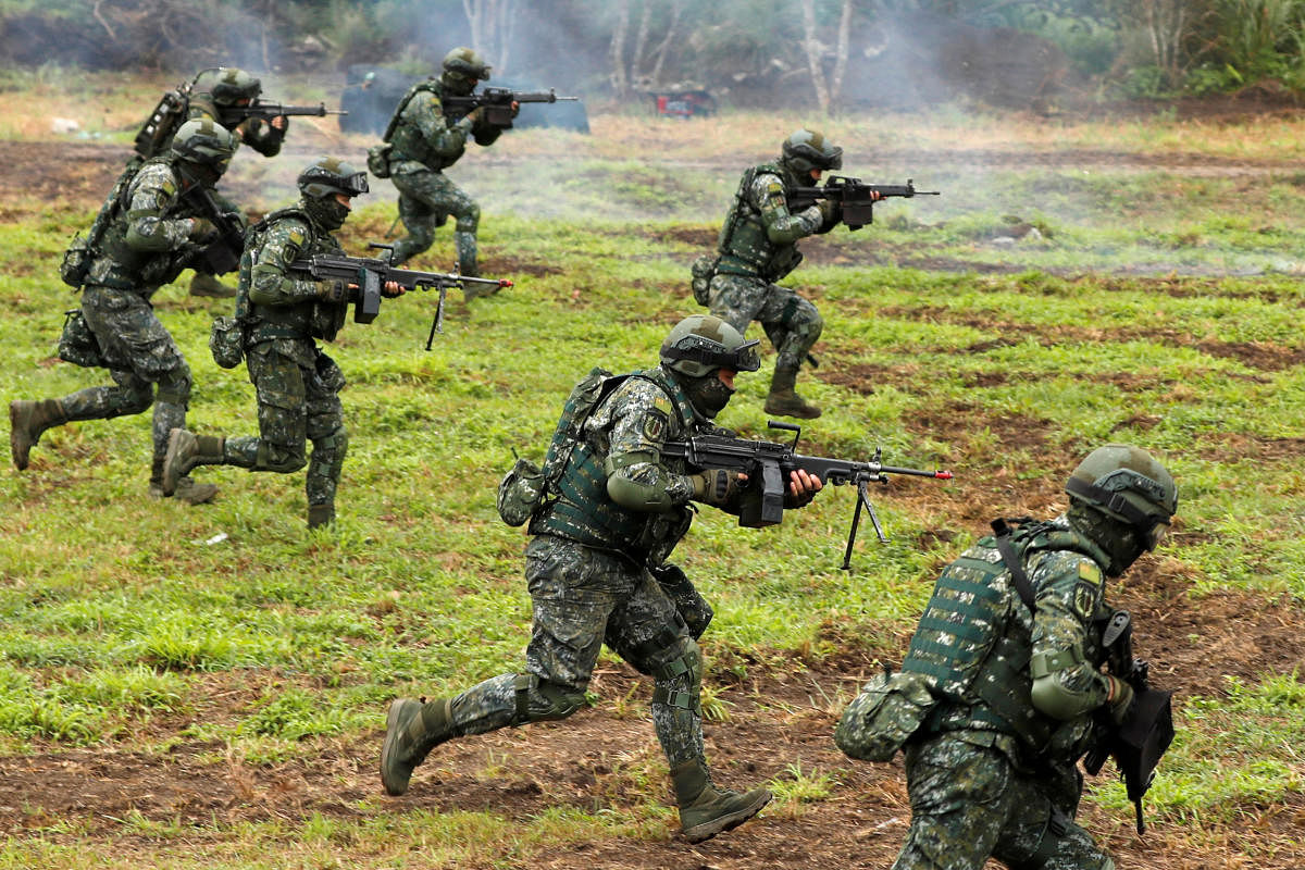 Taiwanese soldiers take part in a military drill in Hualien, eastern Taiwan, on Tuesday. REUTERS