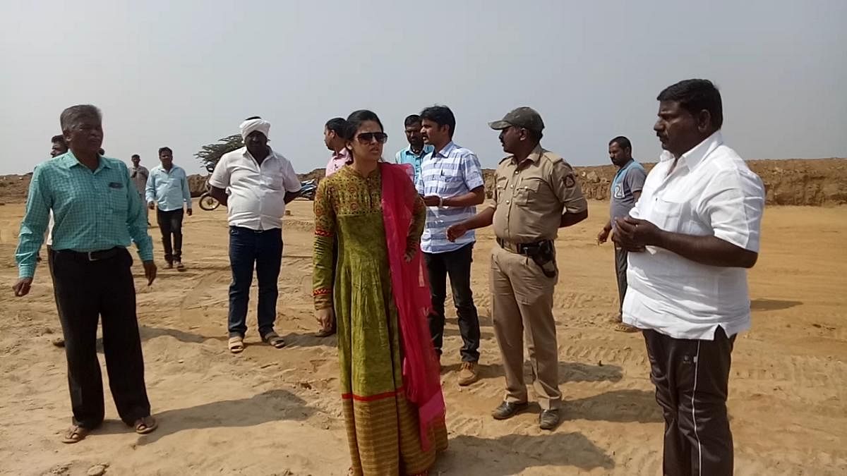 Deputy Commissioner Rohini Sindhuri and officials inspect the illegal mining unit in Hassan taluk on Tuesday.