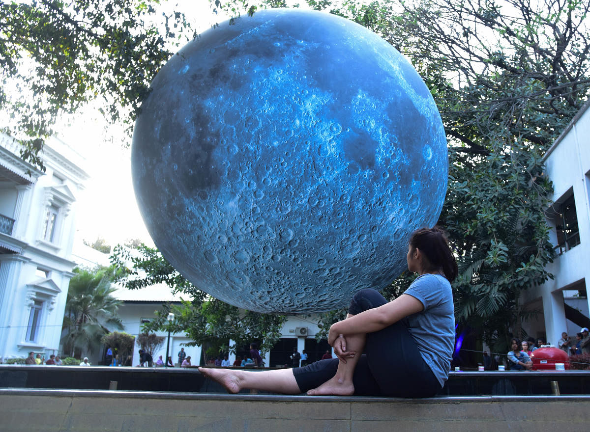 UK artist Luke Jerram has brought the moon down to the earth in the form of a large-scale inflatable orb. Titled 'Museum of Moon', this public artwork has been brought to India by the British Council for a multi-city tour, at NDMA in Bengaluru on Wednesday. Photo/ B H Shivakumarmoon