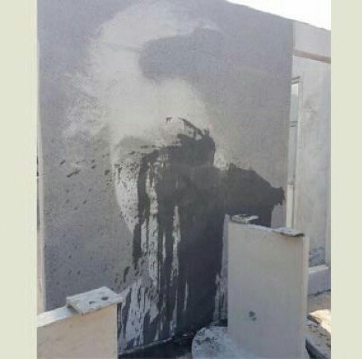 A portrait of former prime minister Indira Gandhi, outside the under-construction Indira Canteen in Suratkal, was smeared with black ink by unidentified persons on Friday night.