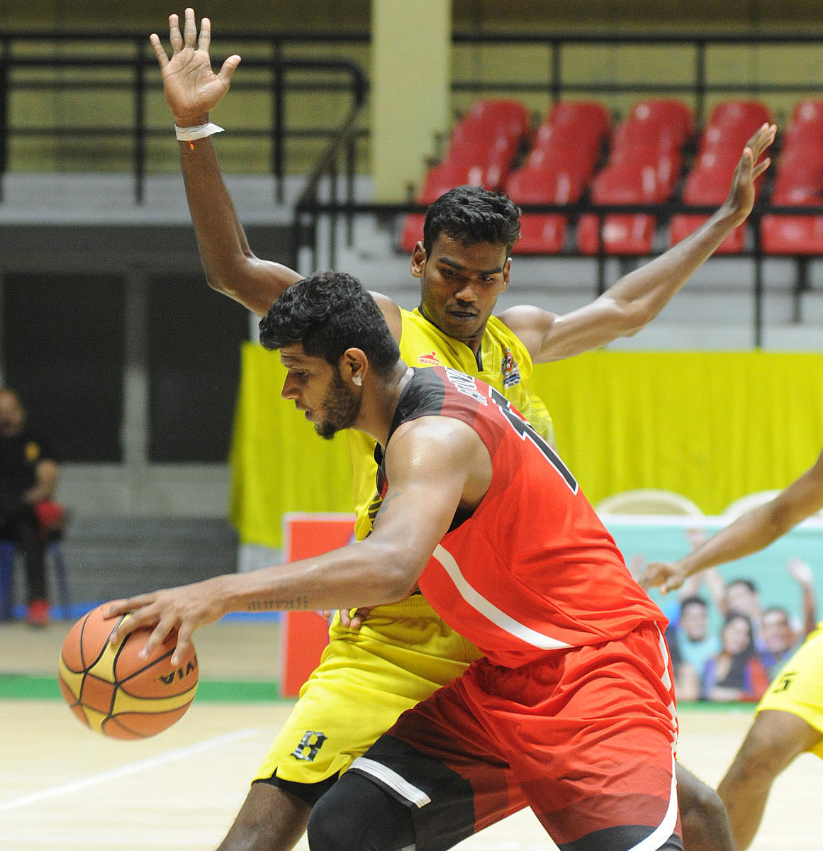 TOO TOUGH: Aravind A (foreground) of Vijaya Bank tries to dribble past P Vijay of ICF during their semifinal match on Saturday