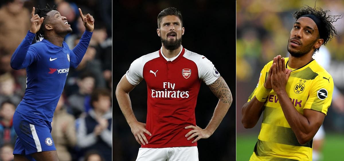 BIG-MONEY DEALS: Olivier Giroud (left) moved from Arsenal to Chelsea while Pierre-Emerick Aubameyang switched allegiance to Arsenal from Borussia Dortmund.