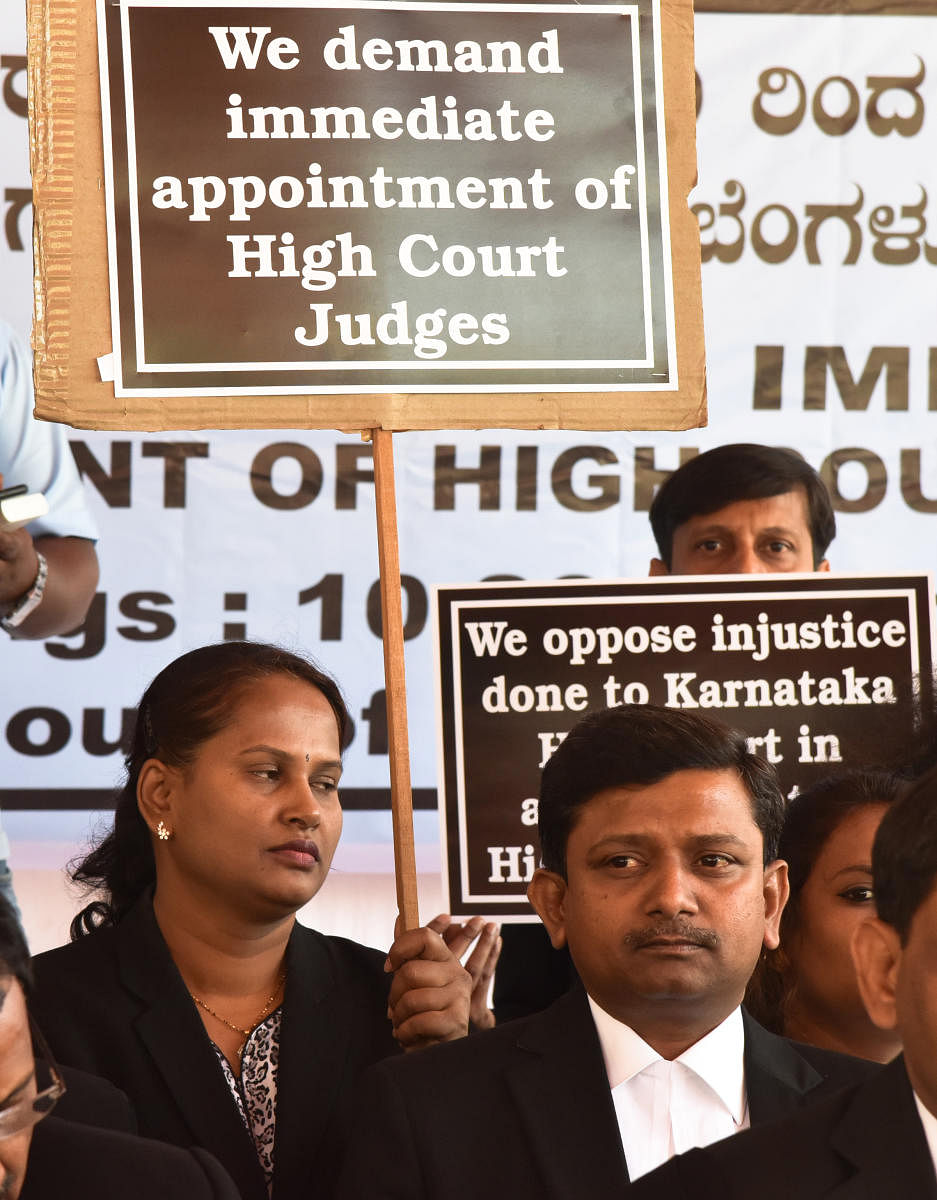 Advocates staging one week hunger strike demanding appointment of High Court Judges in front of Karnataka High Court, organised by The Advocate's Association in Bengaluru on Monday. Photo by S K Dinesh