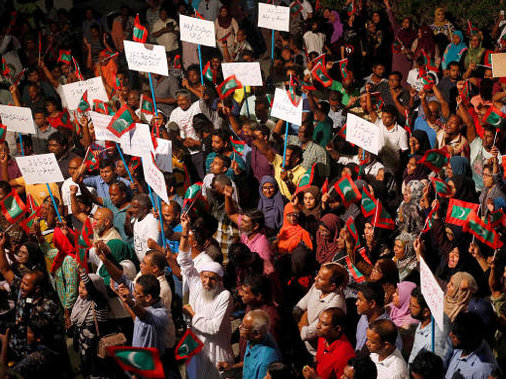 Opposition supporters protest against the government's delay in releasing their jailed leaders, including former president Mohamed Nasheed, despite a Supreme Court order, in Male, Maldives. Reuters photo.