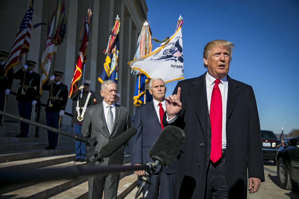 FILE -- President Donald Trump speaks to reporters as he arrives with Defense Secretary James Mattis and Vice President Mike Pence at the Pentagon, in Arlington, Va., Jan. 18, 2018. A new nuclear policy issued by the Trump administration on Friday, Feb. 2, which vows to counter a rush by the Russians to modernize their forces even while staying inside treaty limits, is touching off a new kind of nuclear arms race. (Al Drago/The New York Times)
