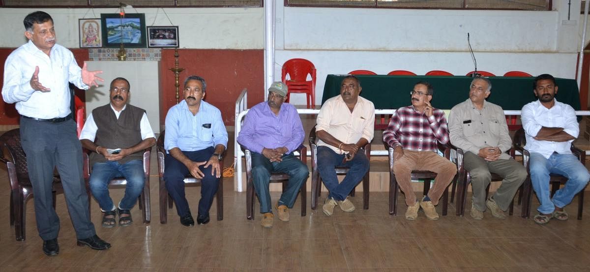 Coorg Wildlife Society president C P Muthanna speaks at a meeting in Madikeri on Wednesday.