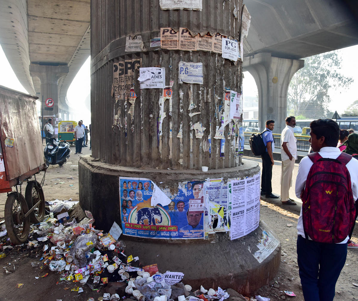 Political posters and cheap advertisements regularly deface the pillars, while the medians have been turned into garbage dumps of hideous proportions. DH Photo/ B H Shivakumar