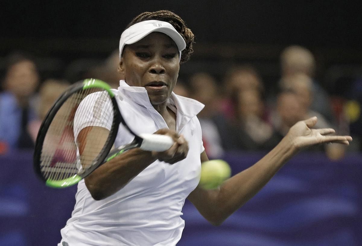 Asheville: USA's Venus Williams hits a return to Netherlands' Arnatxa Rus during a match in the first round of Fed Cup tennis competition in Asheville, N.C., Saturday, Feb. 10, 2018. AP/PTI(AP2_11_2018_000004A)