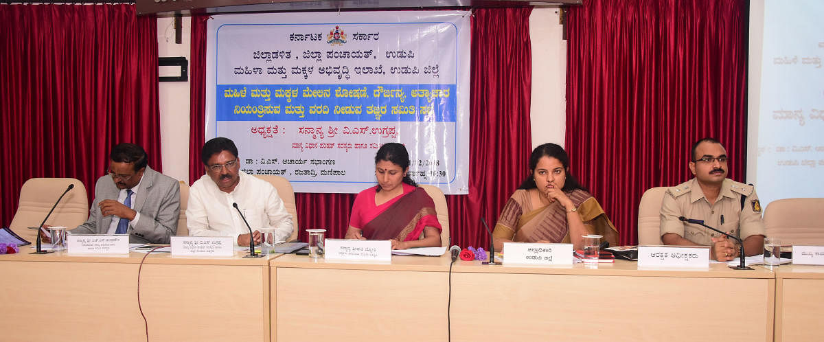 V S Ugrappa, Expert Committee on Prevention of Sexual Violence against Women and Children chairman, speaks at a review meeting in Udupi on Sunday.
