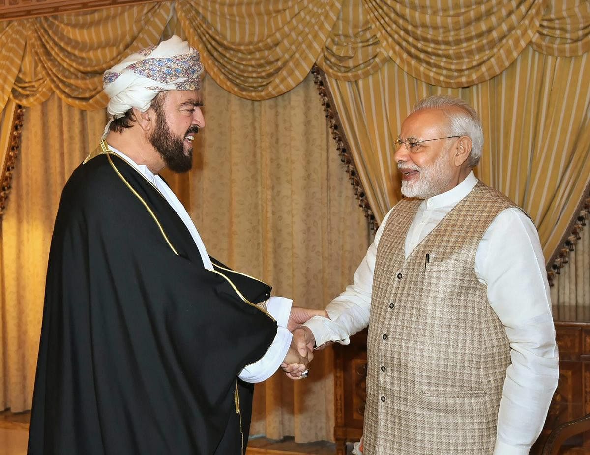 Prime Minister Narendra Modi shakes hands with Deputy Prime Minister of Oman, Sayyid Asa'ad bin Tariq Al Said in Muscat, Oman, on Monday. PTI