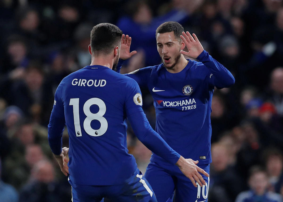 Chelsea's Eden Hazard (right) celebrates with Olivier Giroud after scoring against West Brom on Monday. REUTERS