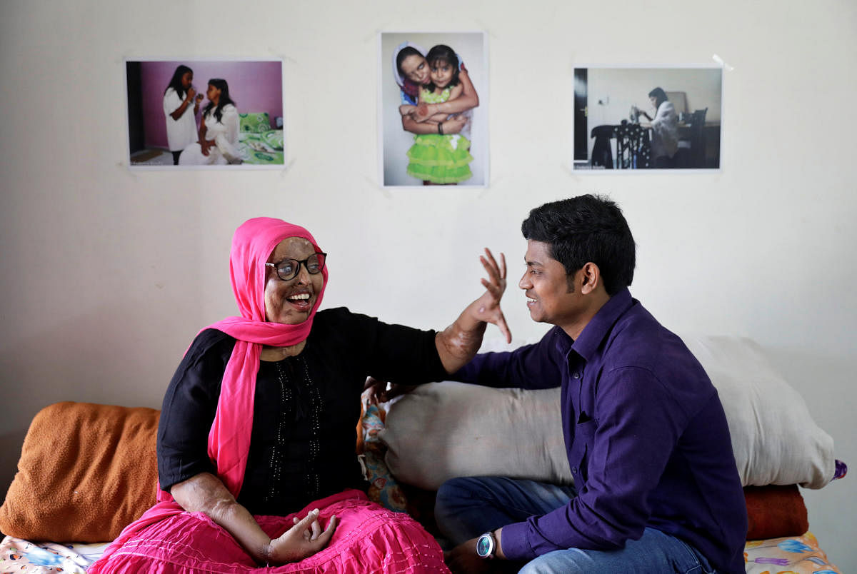 Pramodini Roul, 24, an acid attack survivor and a campaigner at Chhanv, an NGO that supports acid attack victims, and her partner Saroj Sahoo, 26, a manager at Chhanv share a moment at the