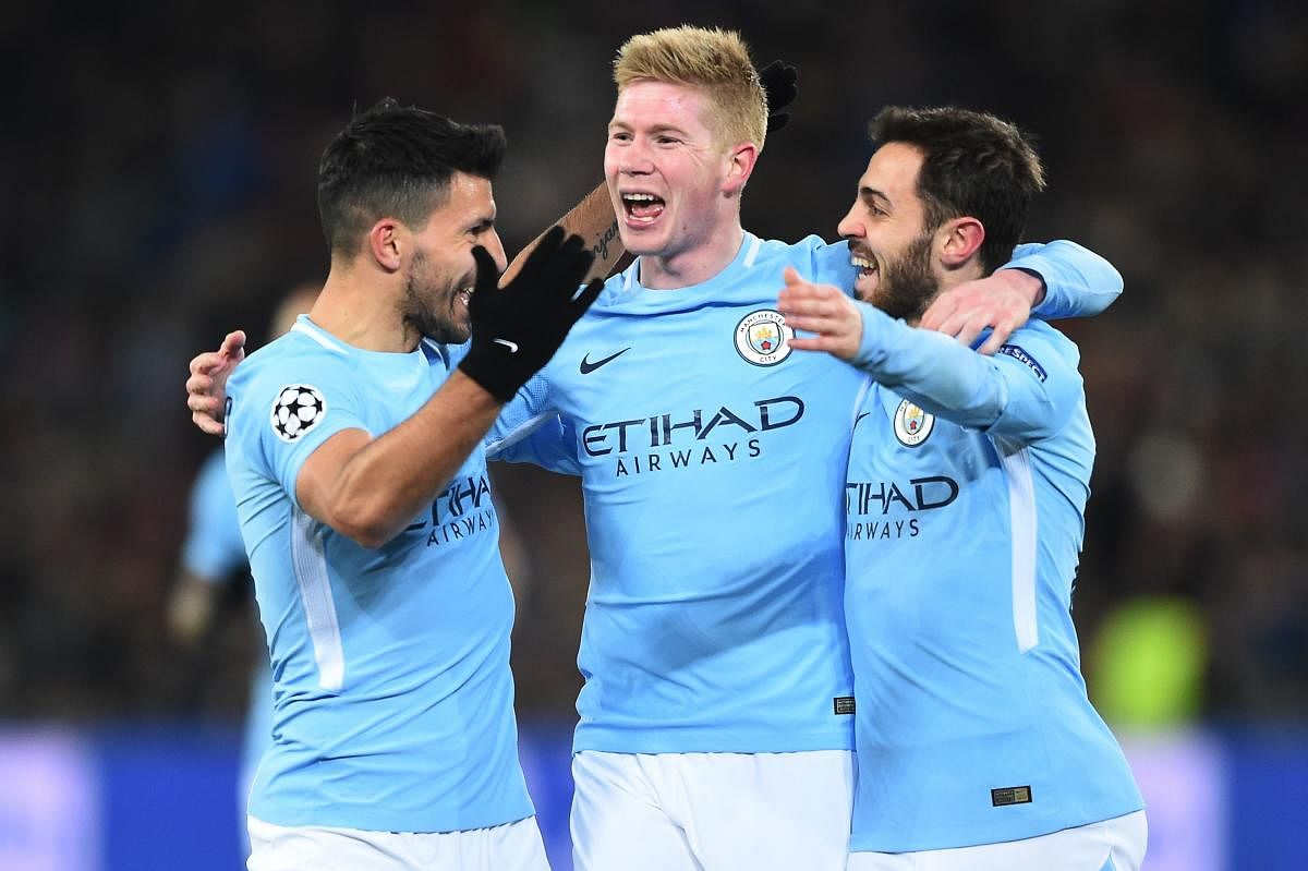 Driving force: Manchester City's Kevin De Bruyne (centre) will look to continue his fine form when they face Wigan Athletic on Saturday. AFP