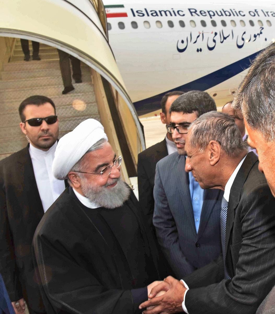 Iranian President Hassan Rouhani being received by Hyderabad Governor E S L Narasimhan on his arrival at the Begumpet Airport in Hyderabad on Thursday. PTI