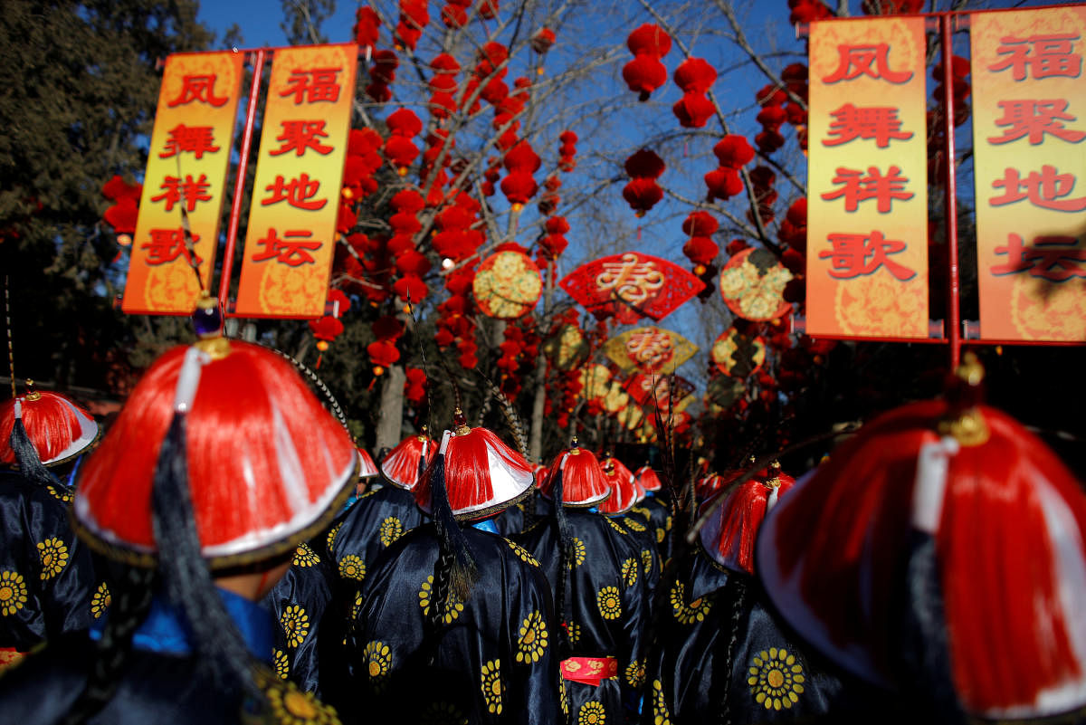 Performers take part in the re-enactment of a Qing Dynasty ceremony, in which emperors prayed for good harvest and fortune for the Chinese New Year, during the Spring Festival Temple Fair in Ditan Park in Beijing, China, on Friday. REUTERS