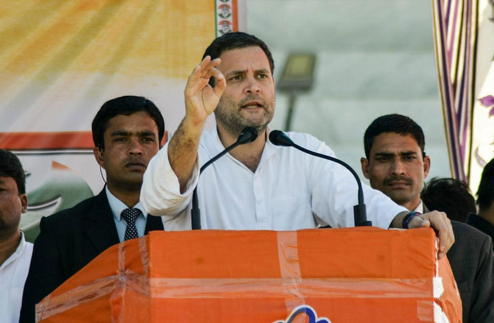 AICC President Rahul Gandhi addresses a gathering on the last day of campaigning for Tripura Assembly elections at Ram Krishna college ground in Kailashahar. PTI photo.