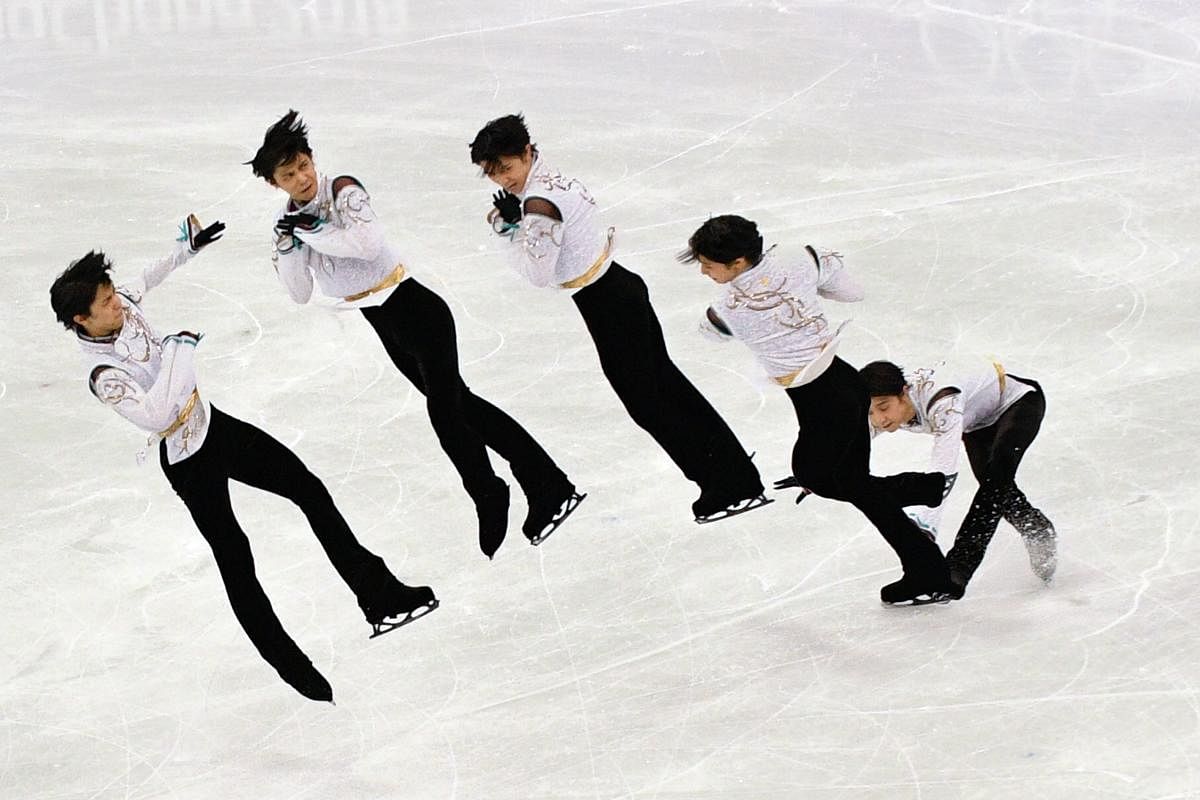 This multiple exposure image shows Japan's Yuzuru Hanyu competing in the free skating segment of the figure skating event at the Winter Olympics on Saturday. AFP