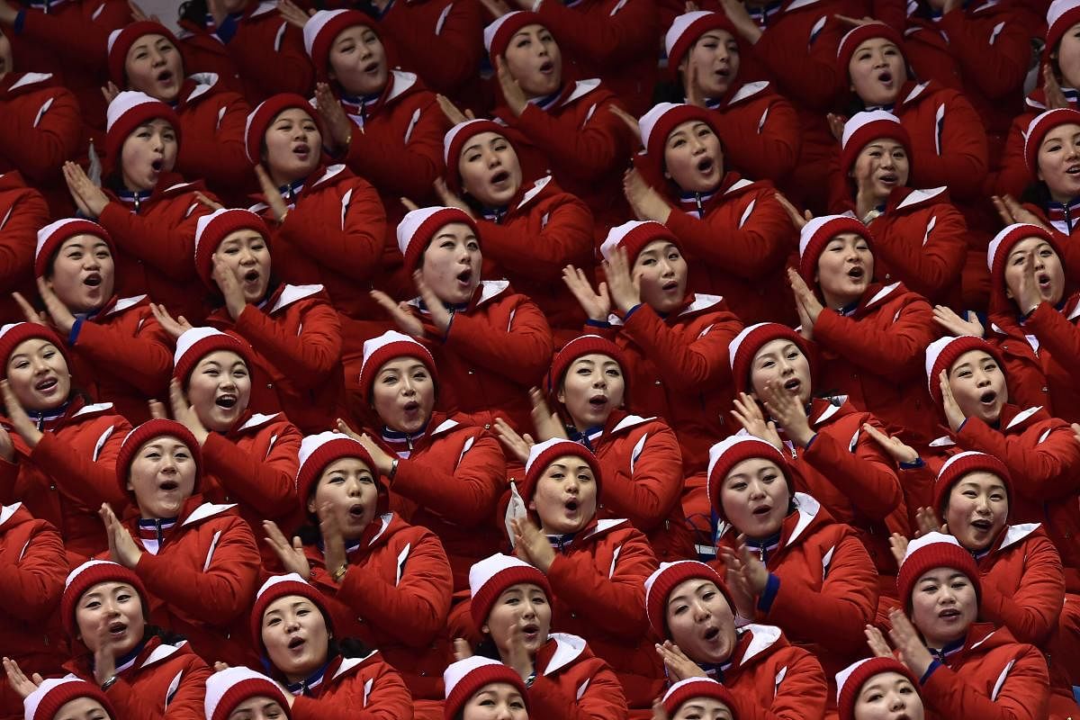 IN UNISON North Korean cheerleaders, who have gained plenty of fan following, root for their team during the figure skating event at the Winter Olympics. AFP