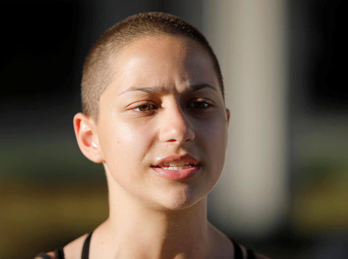 Emma Gonzalez, a senior at Marjory Stoneman Douglas High School, speaks to the media after calling for more gun control at a rally three days after the shooting at her school, in Fort Lauderdale, Florida, U.S. February 17, 2018. REUTERS