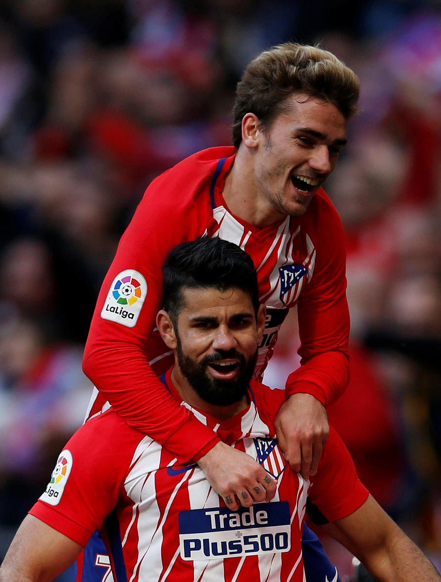 Atletico Madrid's Diego Costa (front) celebrates scoring their second goal with Antoine Griezmann REUTERS