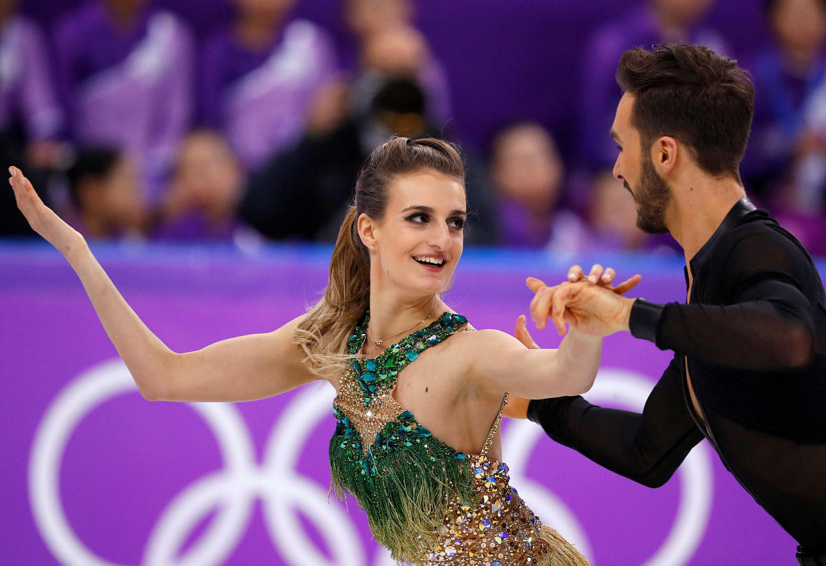 BRAVING THE ODDS Gabriella Papadakis (left) put up a remarkable performance along with Guillaume Cizeron despite suffering an embarrassing wardrobe malfunction. REUTERS