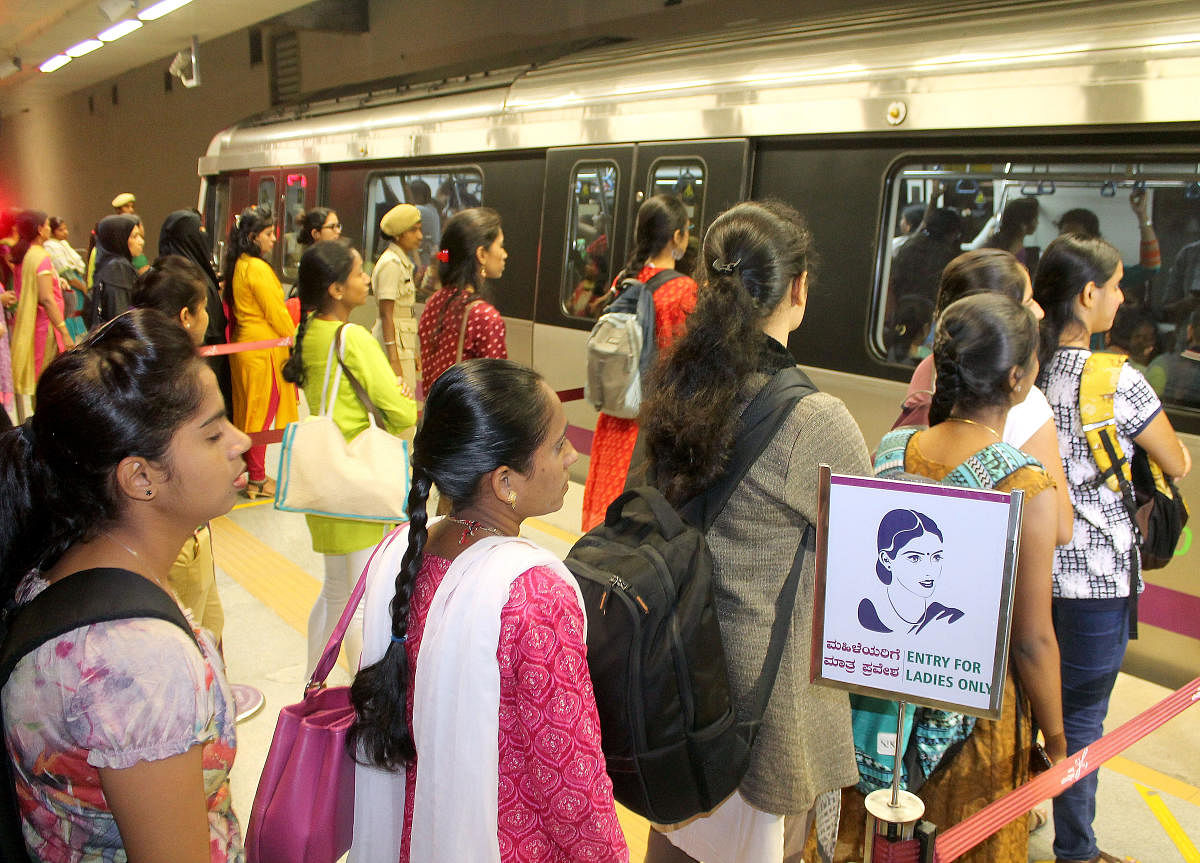 Reservation of first two doors at the front car of Namma Metro trains received positive response women commuters stand in a lane at Mejestic station in Bengaluru on Monday. DH Photo.