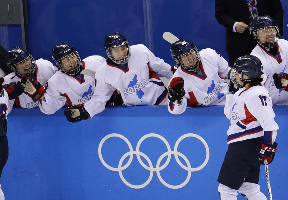 Han Soo-jin of Korea celebrates with teammates after scoring in Pyeongchang 2018 Winter Olympics - Ice Skating - Women's Classification Match - Sweden v Korea. Reuters photo.
