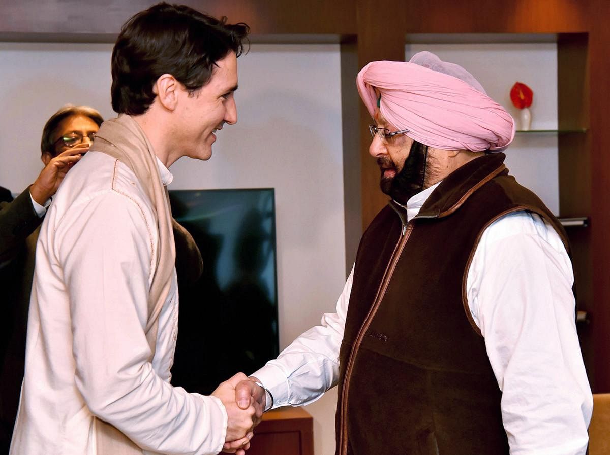 Canadian Prime Minister Justin Trudeau shakes hands with Punjab Chief Minister Amarinder Singh in Amritsar on Wednesday. PTI Photo