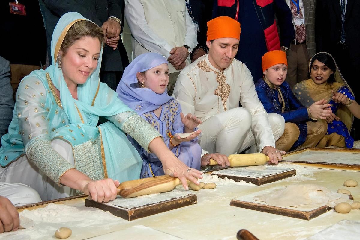 Canadian Prime Minister Justin Trudeau along with his family members prepare langar during their visit to Sri Harmandir Sahib (Golden Temple) in Amritsar on Wednesday. PTI