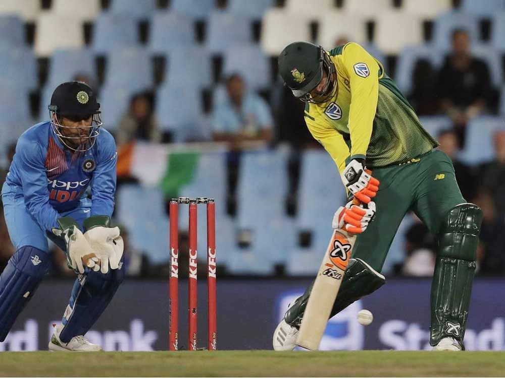 South Africa's batsman Heinrich Klaasen, right, plays a shot as India's wicketkeeper MS Dhoni, watches during the second T20 cricket match between South Africa and India at Centurion Park in Pretoria, South Africa. AP/PTI Photo