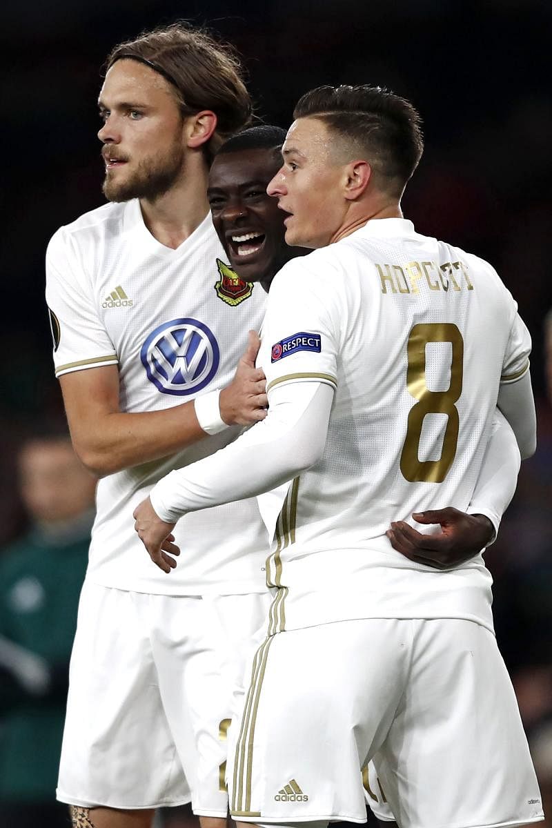 FINE FINISH Ostersunds' Ken Sema (centre) celebrates with team-mates after scoring against Arsenal during their Europa League clash on Thursday. AFP
