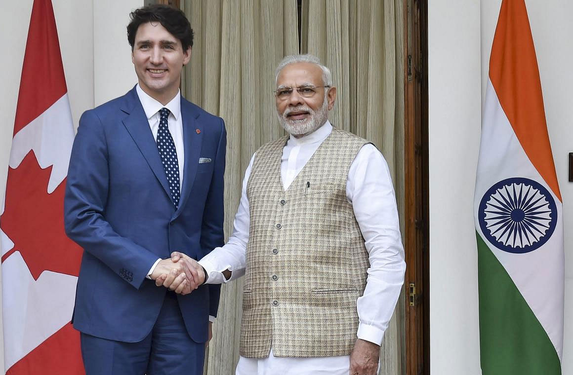 Prime Minister Narendra Modi shakes hands with his Canadian counterpart Justin Trudeau before their meeting at Hyderabad House in New Delhi on Friday. PTI Photo