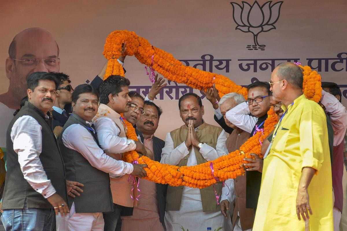 BJP leaders present a garland to Jharkhand Chief Minister Raghubar Das during a party meeting for the Legislative Assembly election, 2019 at Golf Ground in Dhanbad on Thursday. PTI Photo