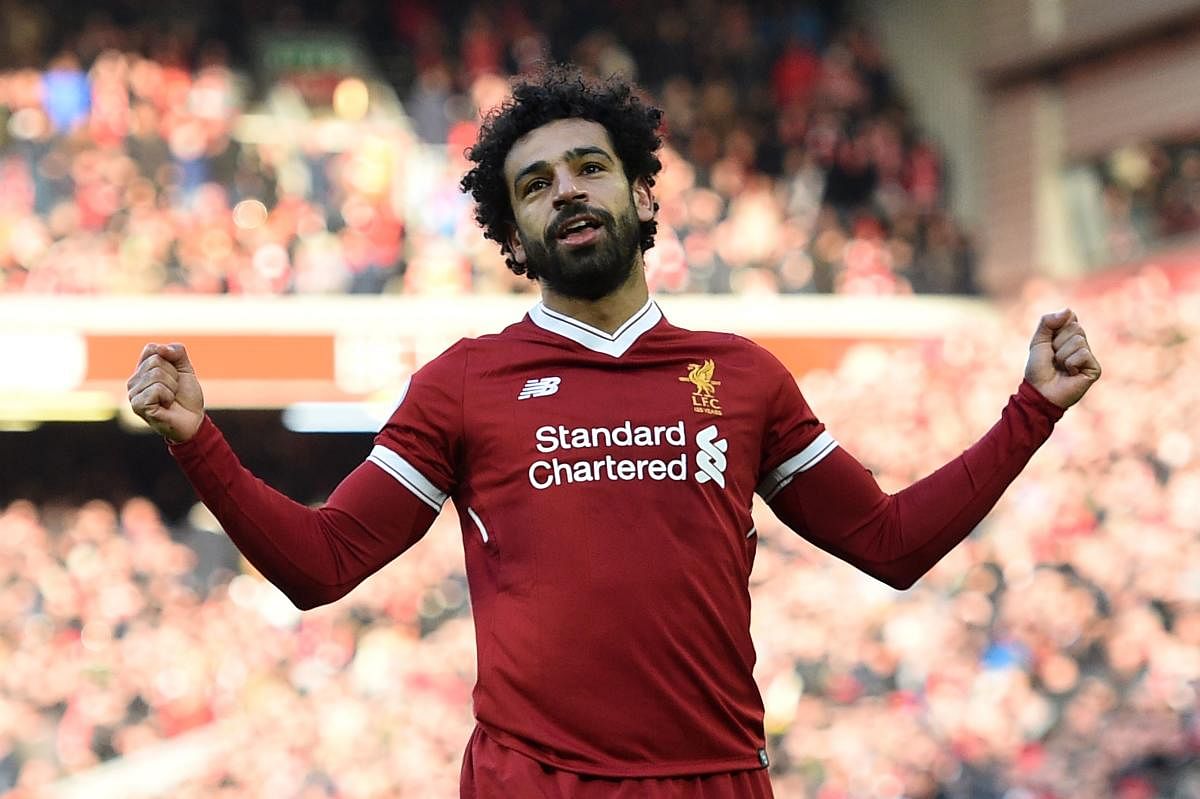 IN IMPERIOUS FORM Liverpool's Mohamed Salah celebrates after scoring against West Ham United on Saturday. AFP