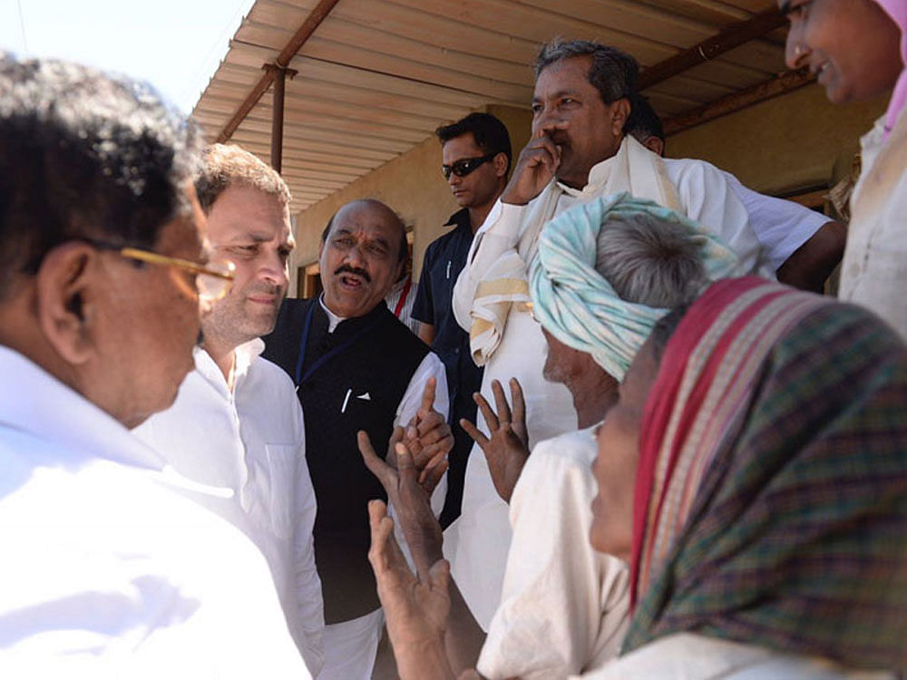 Rahul who is on the last day of the tour, gave a patient ear to farmers'  who spoke of  their crops, loans and incomes.  DH Photo
