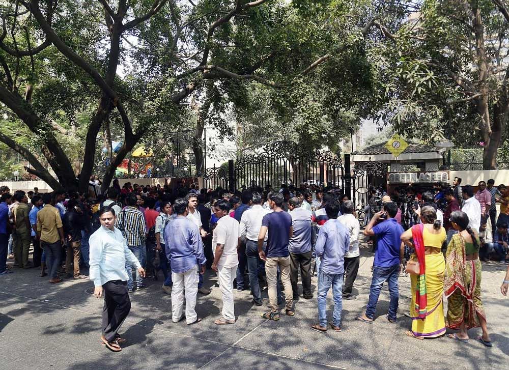 Sridevi fans wait outside her residence at Lokhandwala Complex, in Andheri, north-west, . PTI Photo