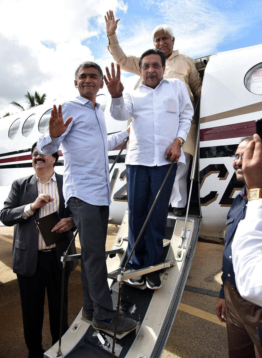 Agriculture Minister Krishna Byre Gowda, Planning, Statistics, Science and Technology Minister M R Seetharam and RDPRminister HKPatil get into the Beechcraft King Air B200 loaded with flares before takeoff after launch of cloud seeding programme at Jakkur Aerodrome in Bengaluru on Monday. Photo by Janardhan B K