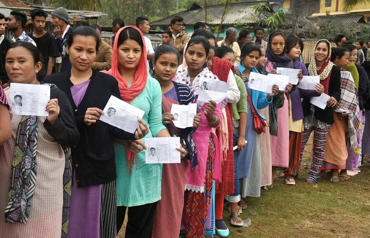 Women stand in a queue to cast their vote at a polling station during the State Assembly elections, in Ri-Bohi district of Meghalaya. PTI