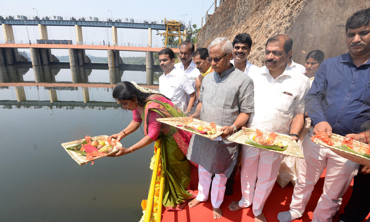 Mayor Kavitha Sanil, MLA J R Lobo and others offer ganga pooja at Thumbe vented dam on Saturday.