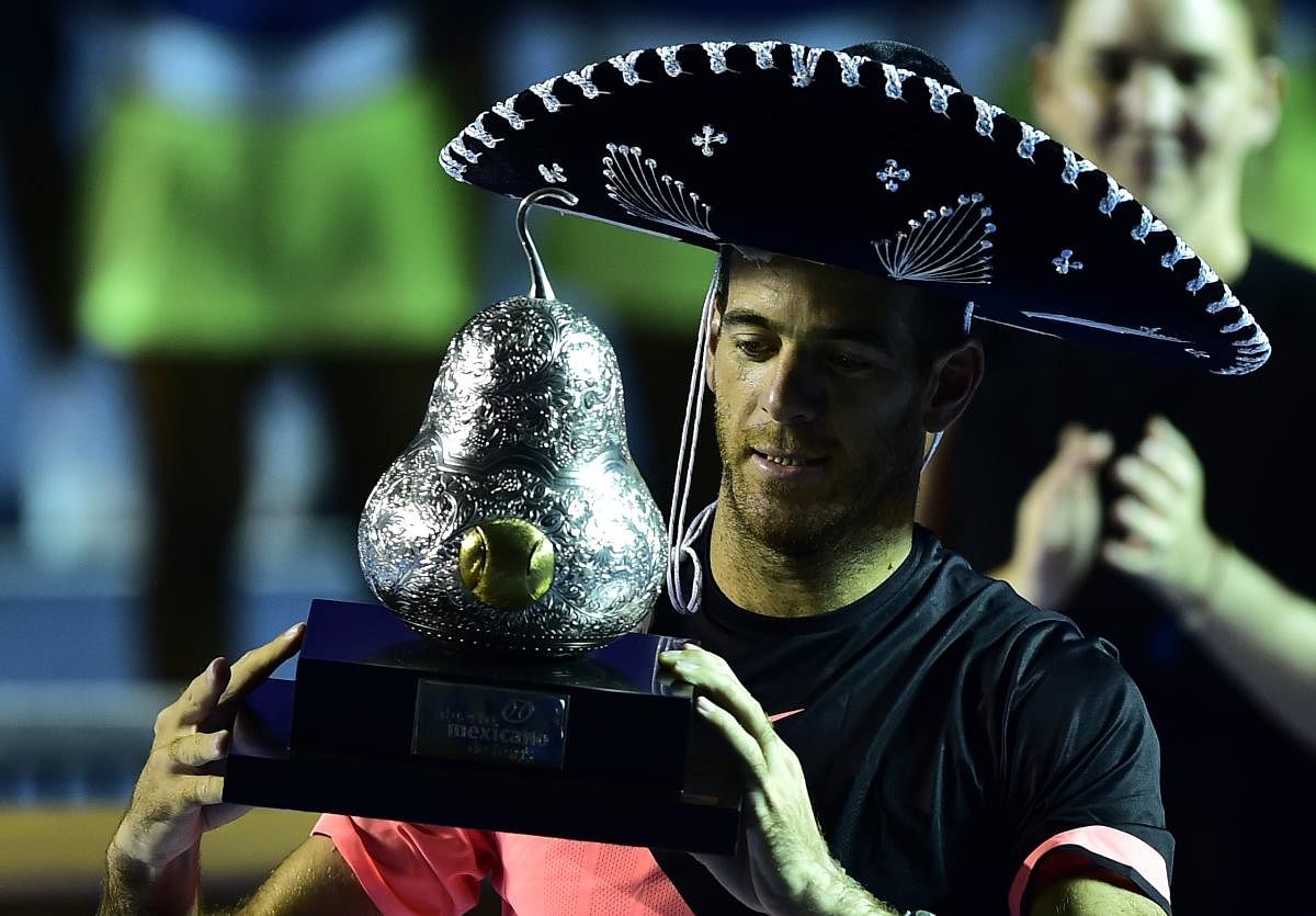 TRIUMPHANT Argentina's Juan Martin del Potro wears a traditional Mexican mariachi hat with the trophy after defeating Kevin Anderson of South Africa. AFP