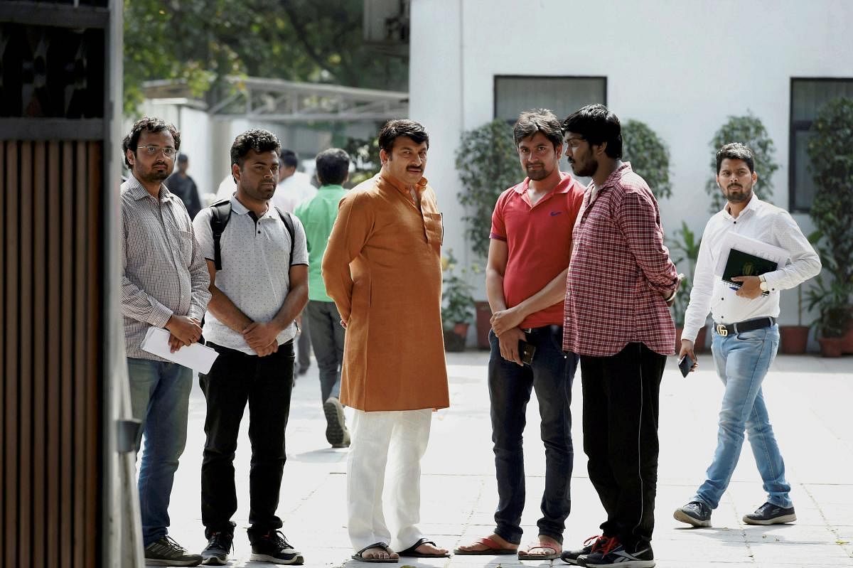 BJP Delhi President Manoj Tiwari with Staff Selection Commission (SSC) aspirants after meeting Union Home Minister Rajnath Singh over the alleged paper leak of SSC, demanding a CBI investigation, in New Delhi.