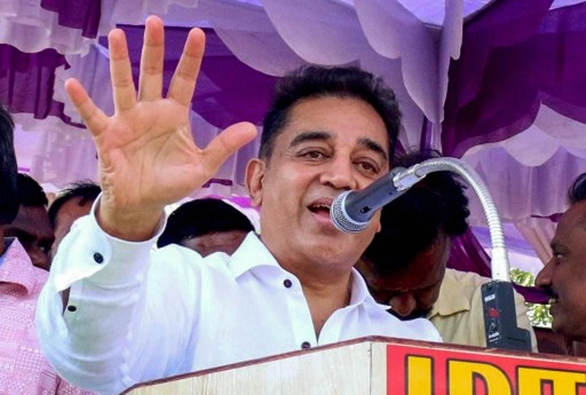 Veteran actor Kamal Hassan speaks during his day-long road show at Manamadurai in Sivaganga district on Wednesday. The actor is all set to launch his political party in Madurai. PTI Photo