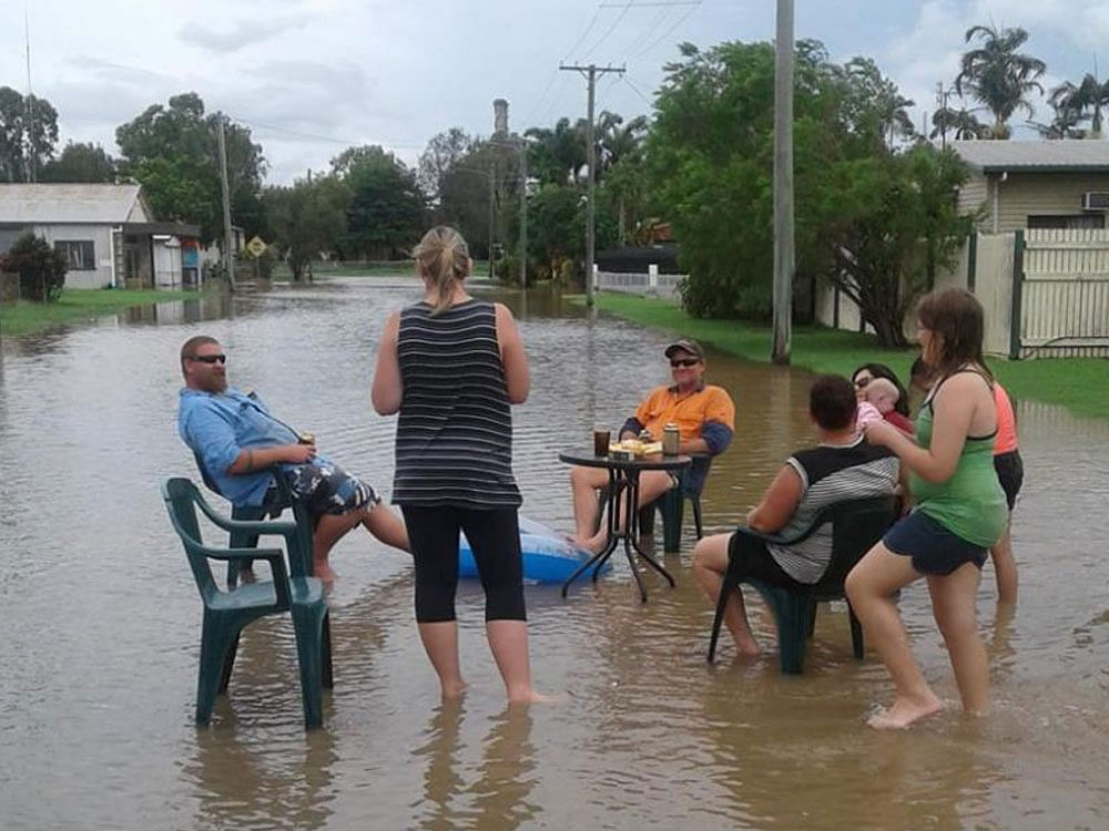 A disaster was declared further east in the coastal cane farming towns of Ingham and Halifax, where television pictures showed the swollen Herbert River rushing over the main highway. Image source:@ClareMortensen