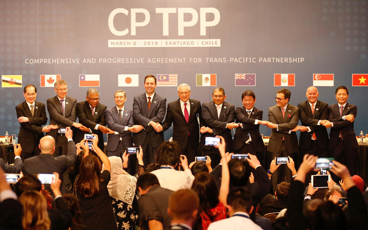 Representatives of members of Trans-Pacific Partnership (TPP) trade deal: Brunei's Acting Minister for Foreign Affairs Erywan Dato Pehin, Chile's Foreign Minister Heraldo Munoz, Australia's Trade Minister Steven Ciobo, Canada's International Trade Minister Francois-Phillippe Champagne, Singapur's Minister for Trade and Industry Lim Hng Kiang, New Zealand's Minister for Trade and Export Growth David Parker, Malaysia's Minister for Trade and Industry Datuk J. Jayasiri, Japan's Minister of Economic Revitalization Toshimitsu Motegi, Mexico's Secretary of Economy Ildefonso Guajardo Villarreal, Peru's Minister of Foreign Trade and Tourism Eduardo Ferreyros Kuppers and Vietnam's Industry and Trade Minister Tran Tuan Anh, pose for an official picture after the signing agreement ceremony in Santiago, Chile March 8, 2018. REUTERS/Rodrigo Garrido