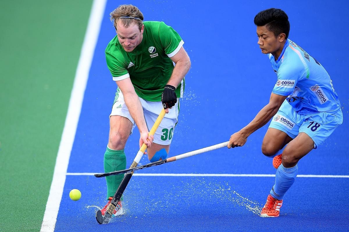 PACY Stuart Loughrey of Ireland (left) vies for the ball with India's Nilakanta Sharma during their fifth-sixth place match of the Sultan Azlan Shah Cup hockey tournament. AFP