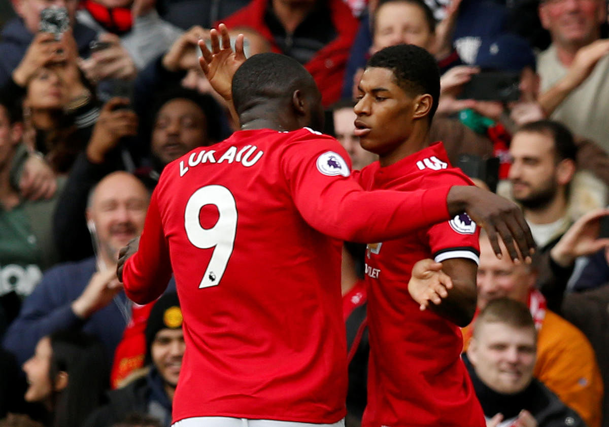 EARLY CHARGE Manchester United's Marcus Rashford (right) celebrates with Romelu Lukaku after scoring against Liverpool during their Premier League clash on Saturday. REUTERS