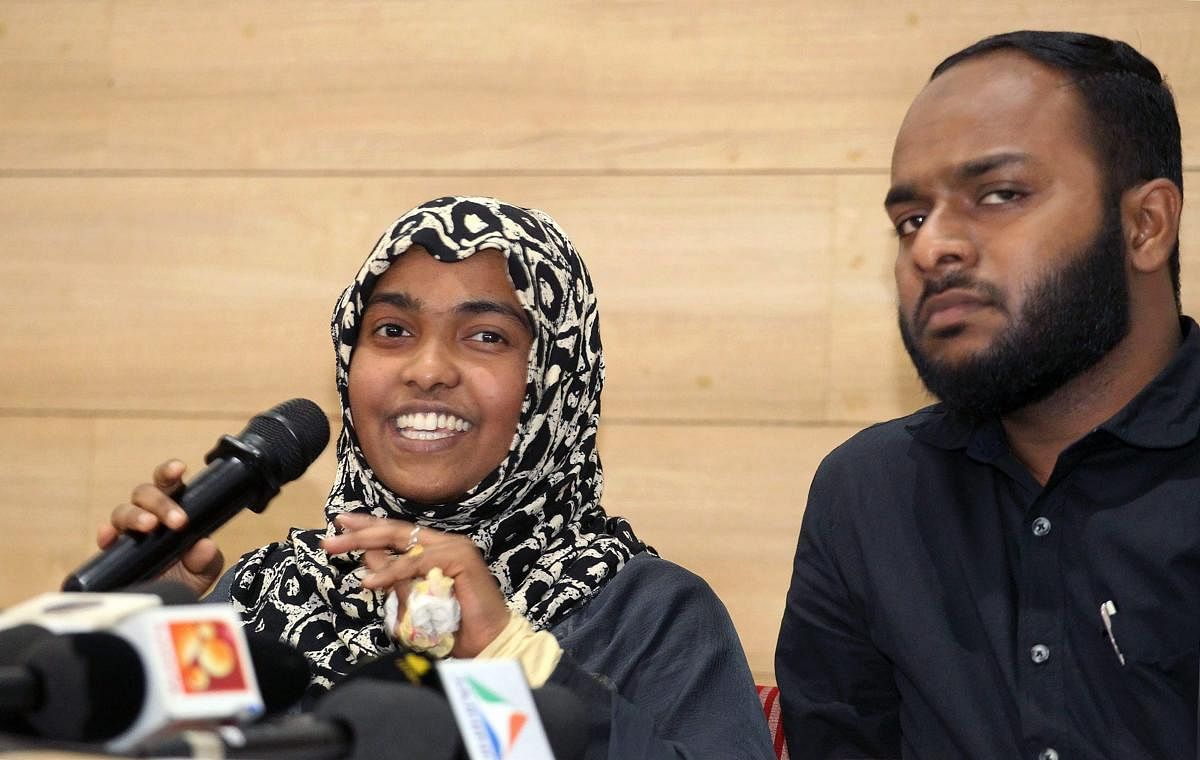 Hadiya with her husband Shafin Jahan speaks to media after Supreme Court order in Kozhikode. PTI Photo