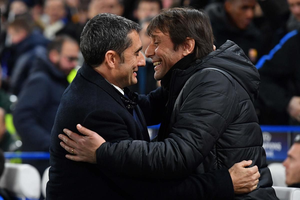 CONTRASTING FORTUNES: Chelsea coach Antonio Conte (right) and Barcelona coach Ernesto Valverde, who've had their share of troubles this season, will be looking to get the better each other on Wednesday. AFP
