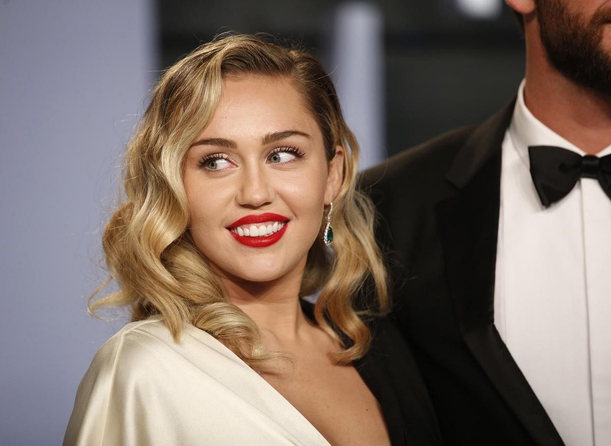 Miley Cyrus was sued for $300 million on Tuesday by a Jamaican songwriter who said the pop singer's 2013 smash